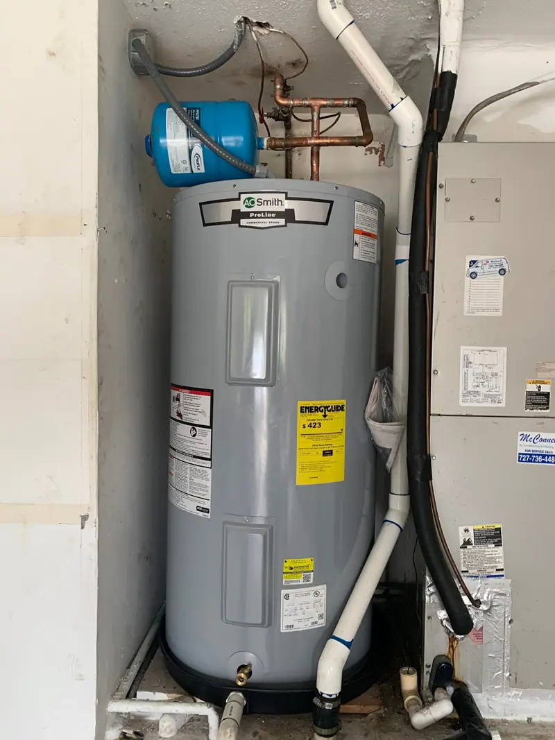 Electric water heater with an expansion tank in a garage