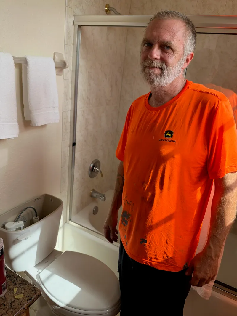 3 J's plumber in a customer's bathroom during a toilet install